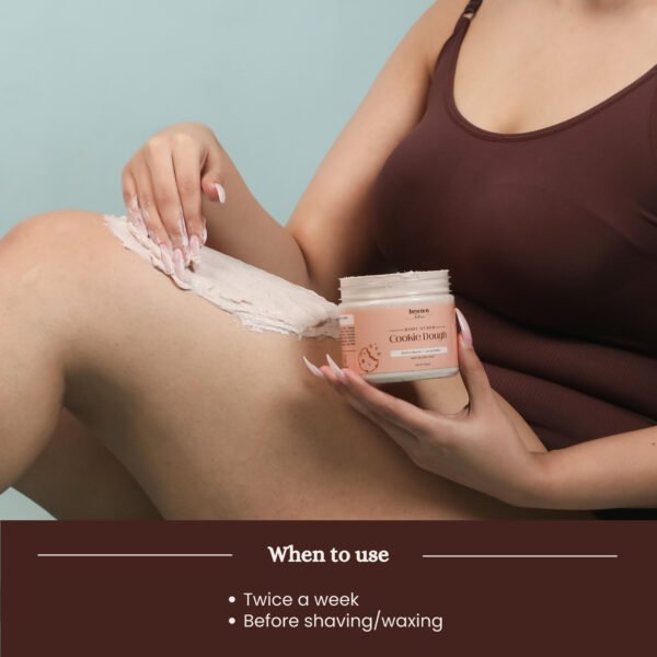 Model applying Cookie Dough chocolate body scrub