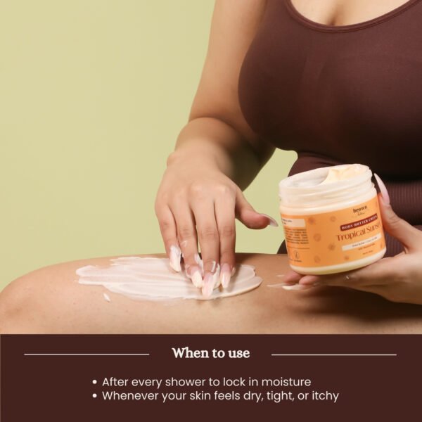 Model applying Tropical Sunset Coconut Body Butter