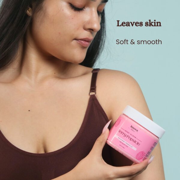 Model holding Berry Popsicle fruit body scrub soft skin