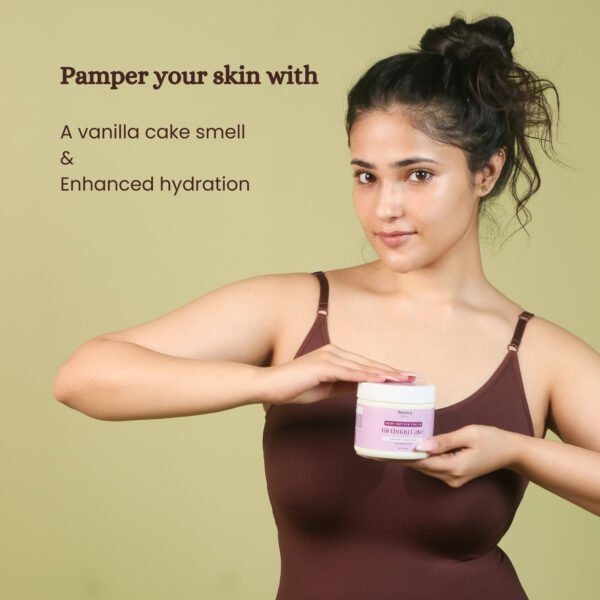 Model holding Birthday Cake Body Vanilla Body Butter glowing skin