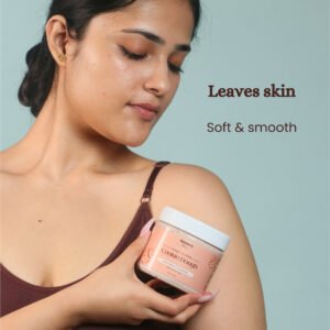 Model holding Cookie Dough chocolate body scrub soft skin