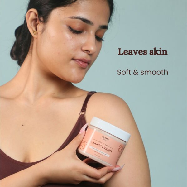 Model holding Cookie Dough chocolate body scrub soft skin