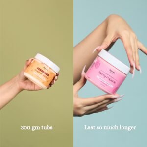 girl holding tropical body butter & berry body scrub